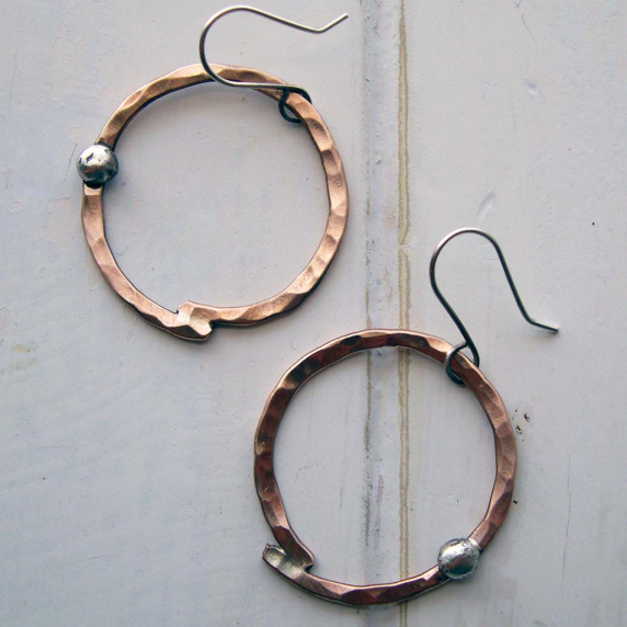 Hammered bronze hoops with sterling accent.